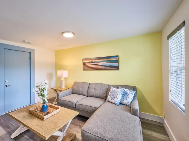 a living room with furniture and a table