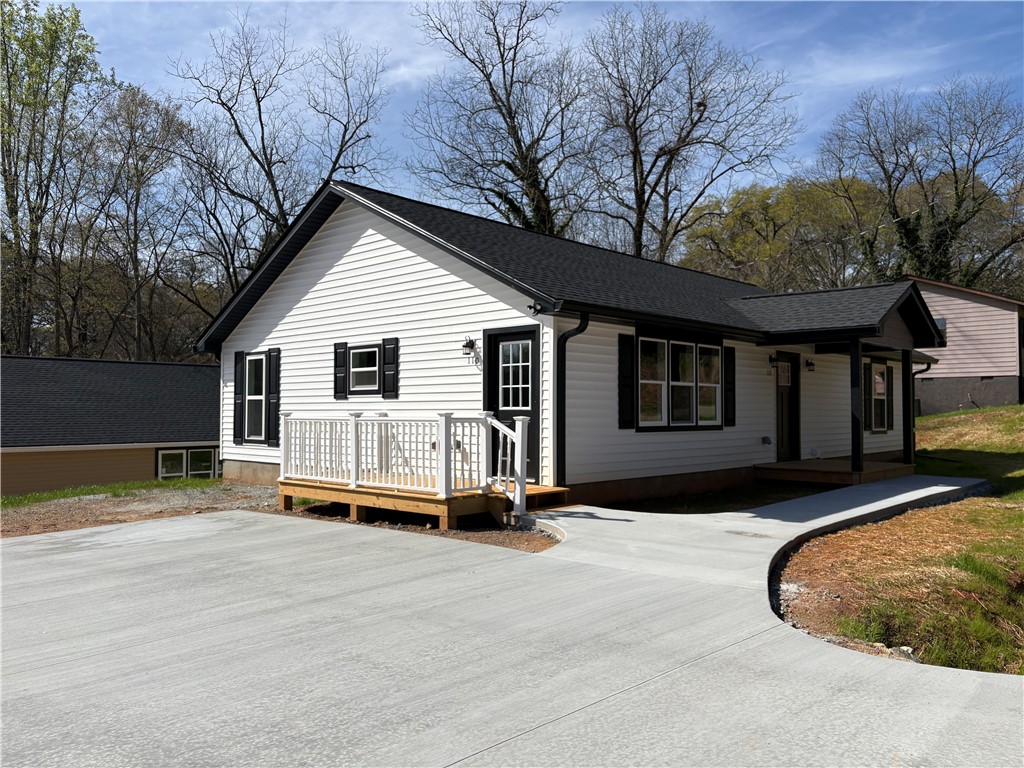 110 Ware Street Seneca, SC 29678 - Photo 2 of 24 This newly constructed home features a welcoming porch and a spacious driveway.