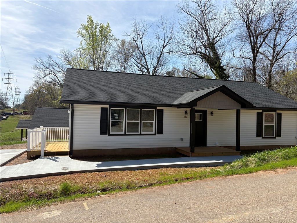 110 Ware Street Seneca, SC 29678 - Photo 3 of 24 This charming home features classic siding and a welcoming porch, perfect for enjoying quiet mornings.
