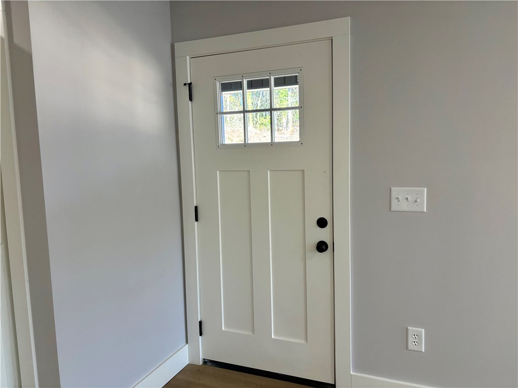 110 Ware Street Seneca, SC 29678 - Photo 8 of 24 This inviting entrance features a classic white door with a window, creating a bright and welcoming atmosphere.
