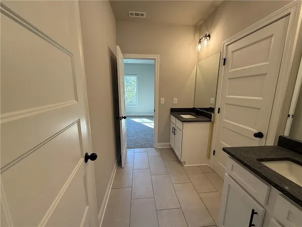 an empty room with windows and closet