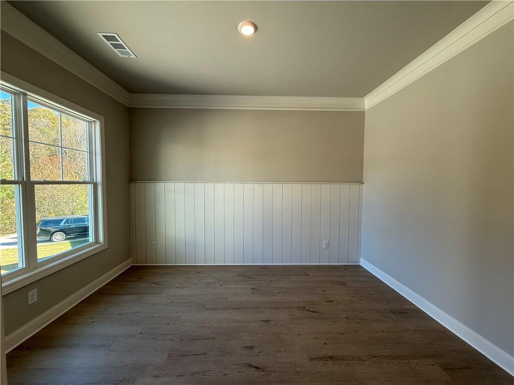 3844 Cheyenne Lane Jefferson, GA 30549 - Photo 6 of 36 an empty room with wooden floor and windows