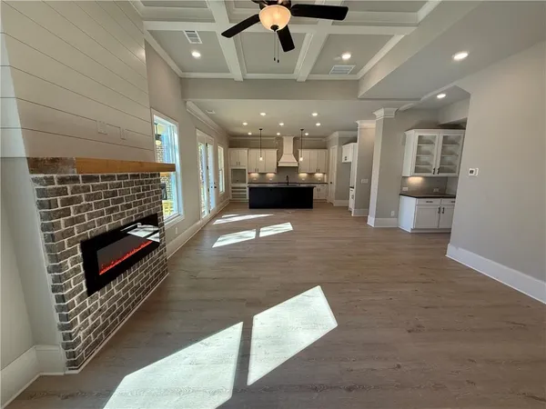 a view of kitchen with refrigerator and window