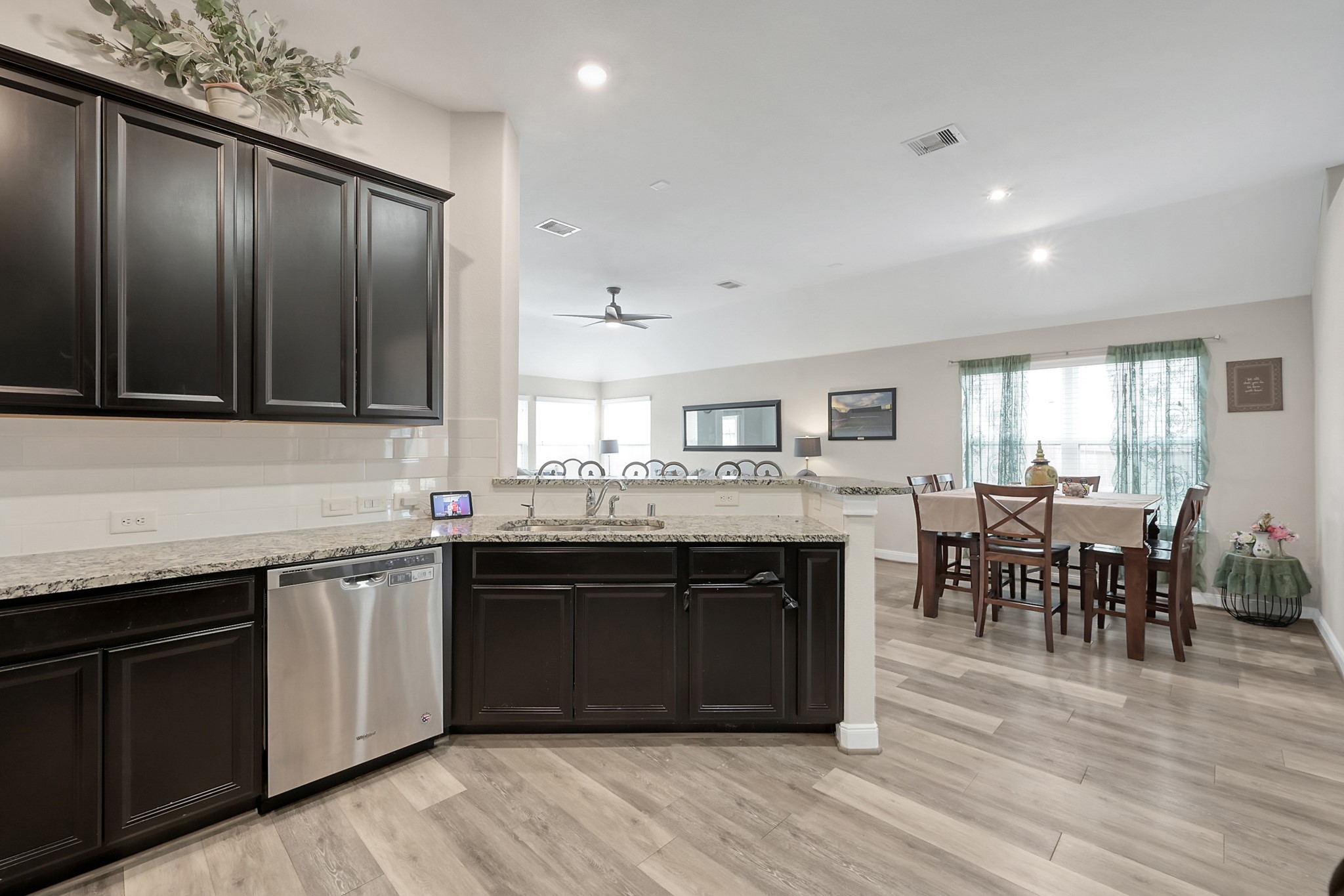 17923 Durango Point Court Tomball, TX 77377 - Photo 11 of 36 The kitchen is open to the breakfast area and family room which allows for easy entertaining.