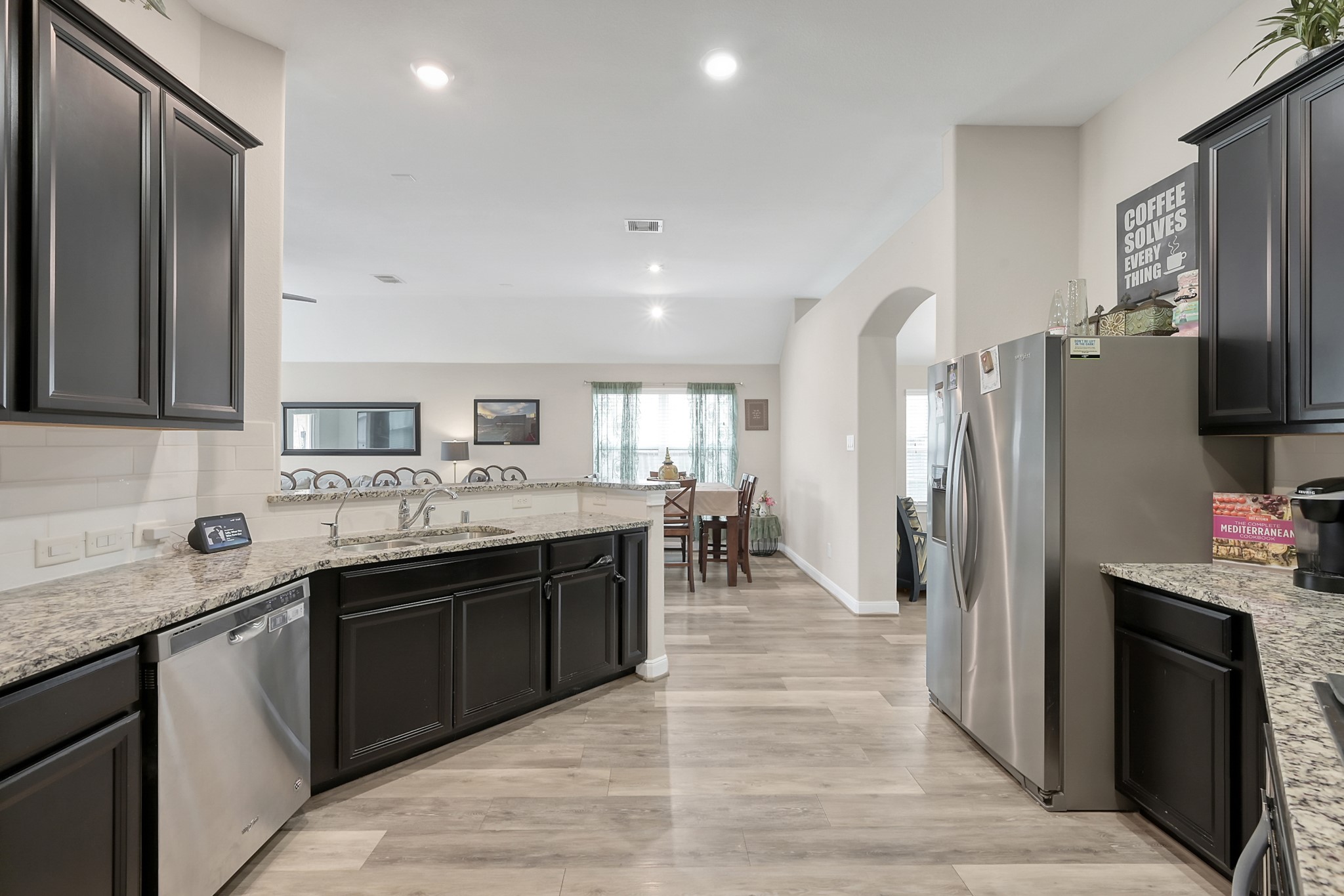 17923 Durango Point Court Tomball, TX 77377 - Photo 12 of 36 Another view of the kitchen with an abundance of cabinets and counter space.