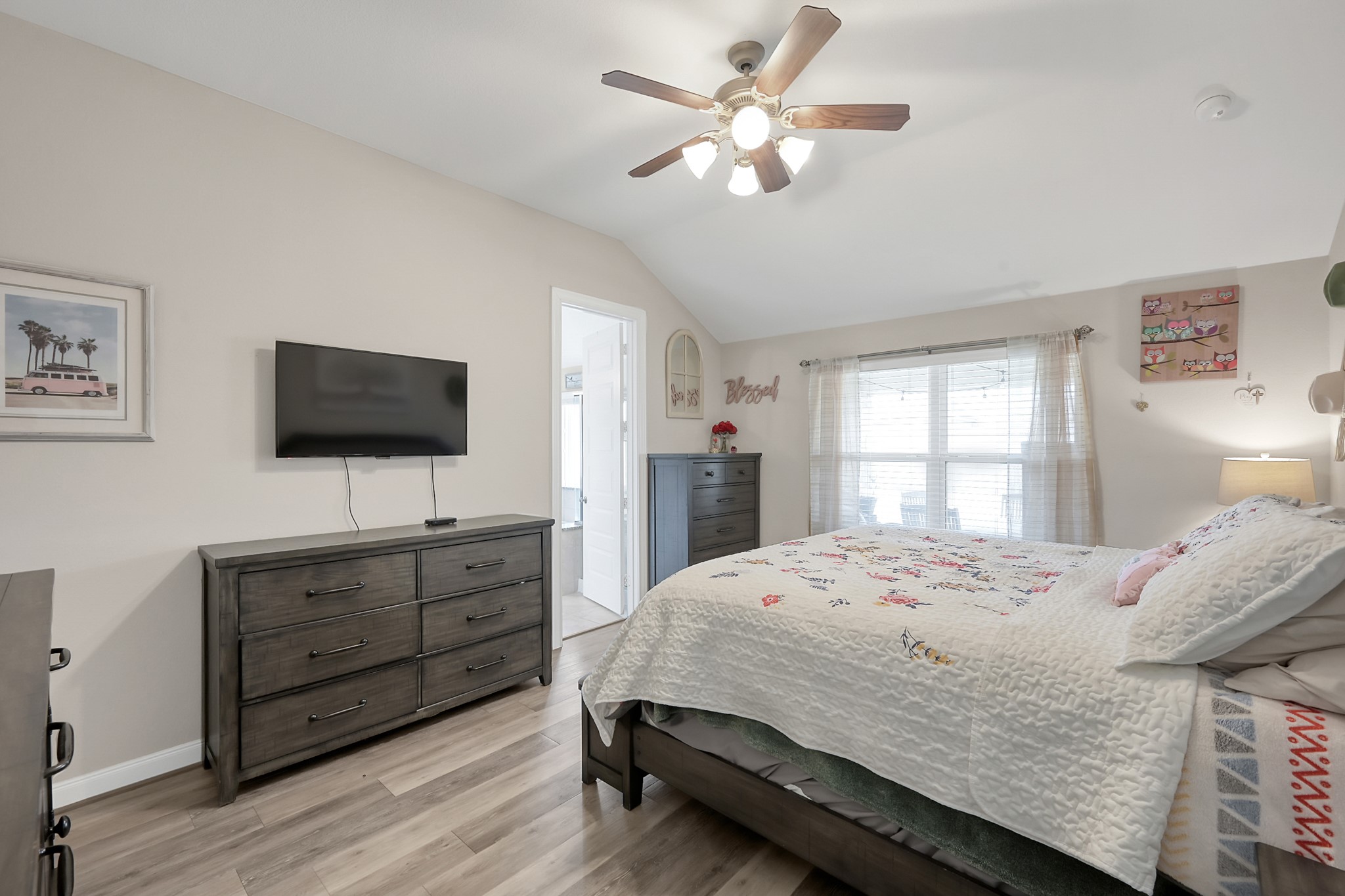 17923 Durango Point Court Tomball, TX 77377 - Photo 21 of 36 The high ceilings and LVP flooring continue into the primary bedroom.