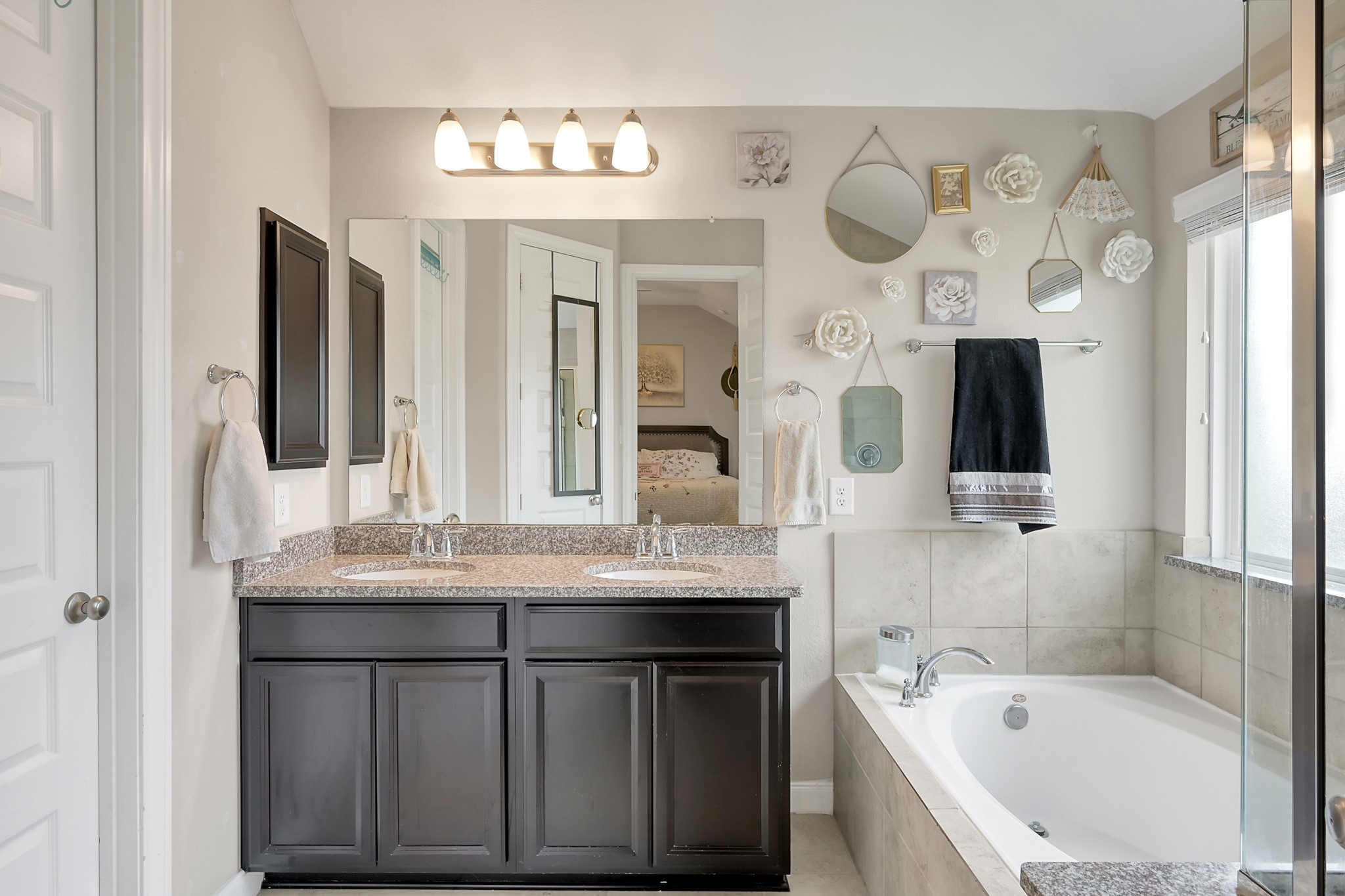 17923 Durango Point Court Tomball, TX 77377 - Photo 24 of 36 The primary bathroom has tile floors and dual sinks with granite a granite counter top plus a medicine cabinet.
