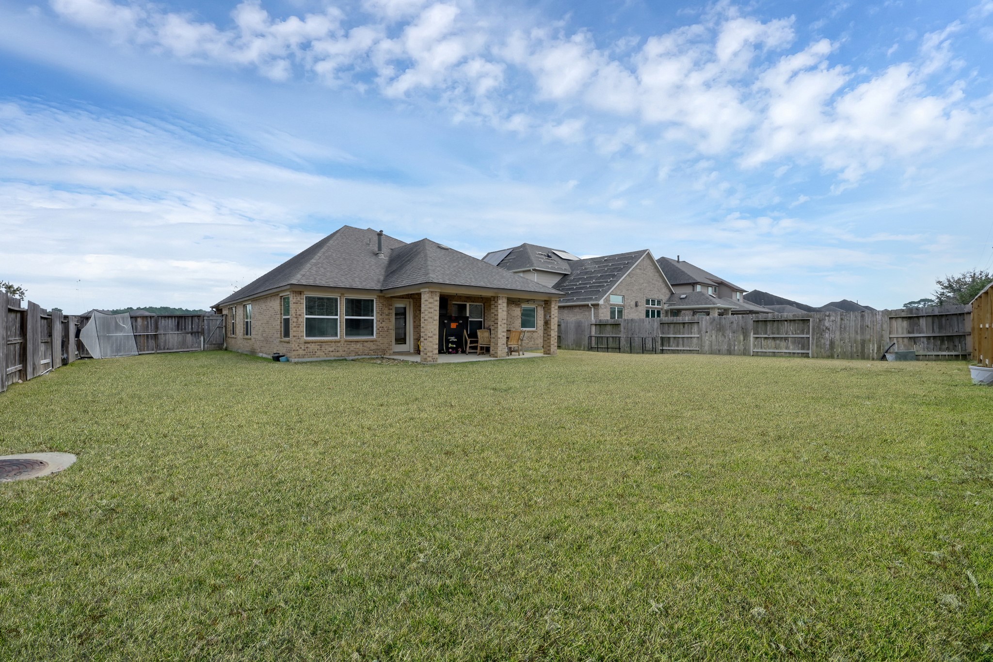 17923 Durango Point Court Tomball, TX 77377 - Photo 35 of 36 There is a large covered patio perfect for outdoor living and dining.