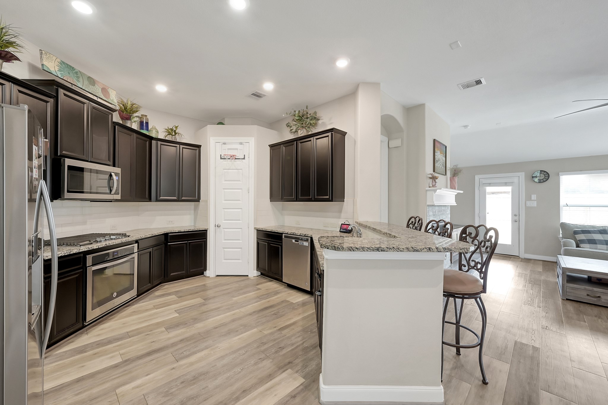 17923 Durango Point Court Tomball, TX 77377 - Photo 10 of 36 There is a walk-in pantry and a gas cooktop for the serious cook in the family.