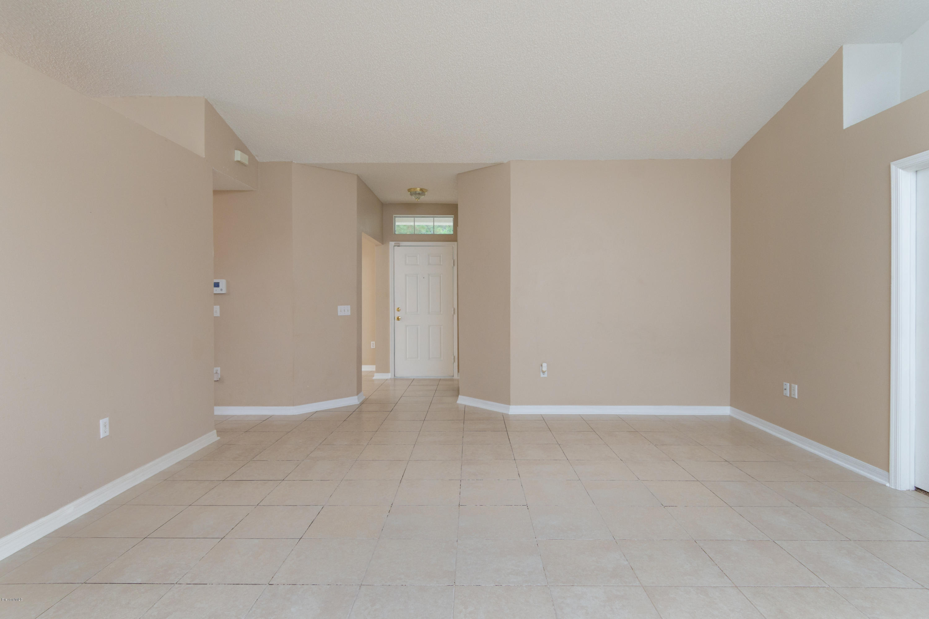 880 Tupelo Road Southwest Palm Bay, FL 32908 - Photo 4 of 15 Family Room View to Foyer