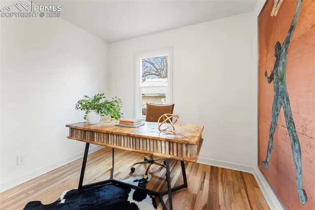 a table that has a table chair and a wooden floor