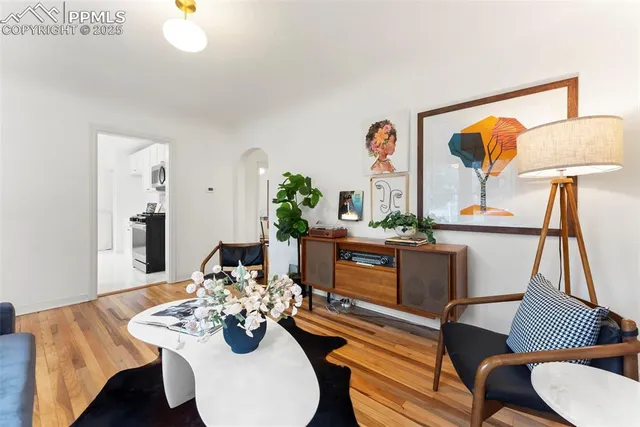a view of a dining room with furniture and wooden floor