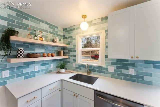 a kitchen with a sink and cabinets