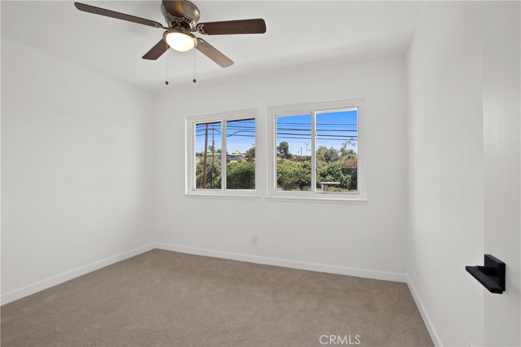 4635 Beach Boulevard Buena Park, CA 90621 - Photo 12 of 32 an empty room with windows and fan