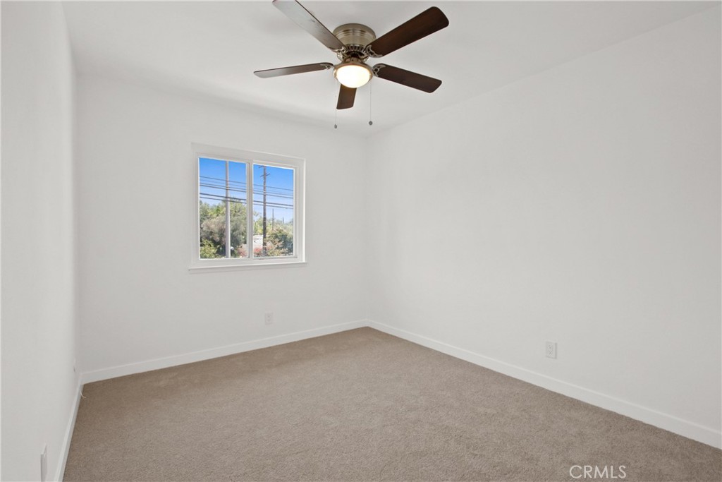 4635 Beach Boulevard Buena Park, CA 90621 - Photo 14 of 32 an empty room with a window and a fan