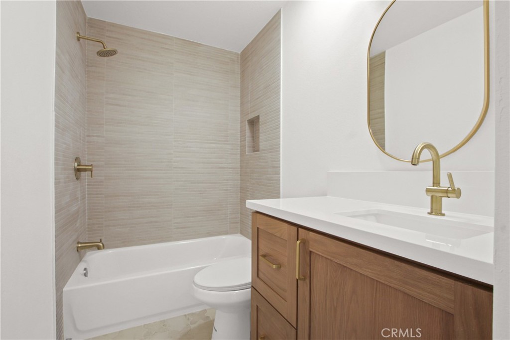 4635 Beach Boulevard Buena Park, CA 90621 - Photo 16 of 32 a bathroom with a sink toilet and shower