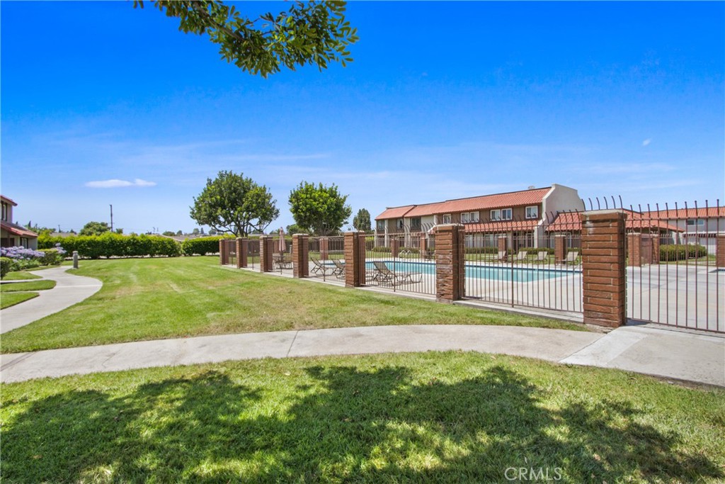 4635 Beach Boulevard Buena Park, CA 90621 - Photo 29 of 32 a view of a house with a yard and a palm tree