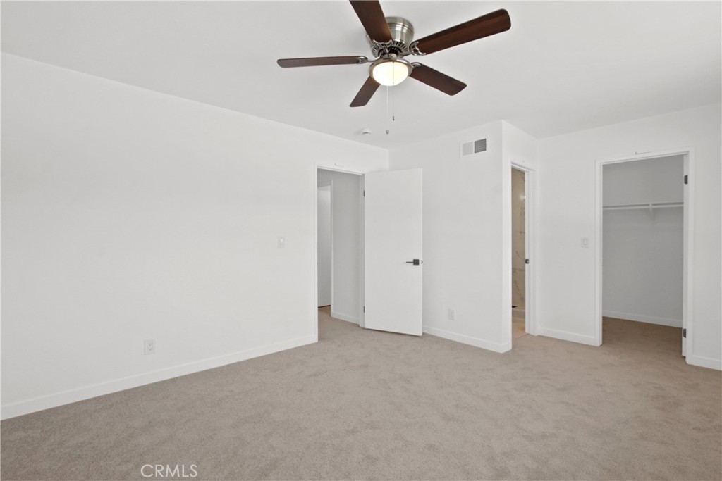 4635 Beach Boulevard Buena Park, CA 90621 - Photo 8 of 32 an empty room with a ceiling fan and a ceiling fan