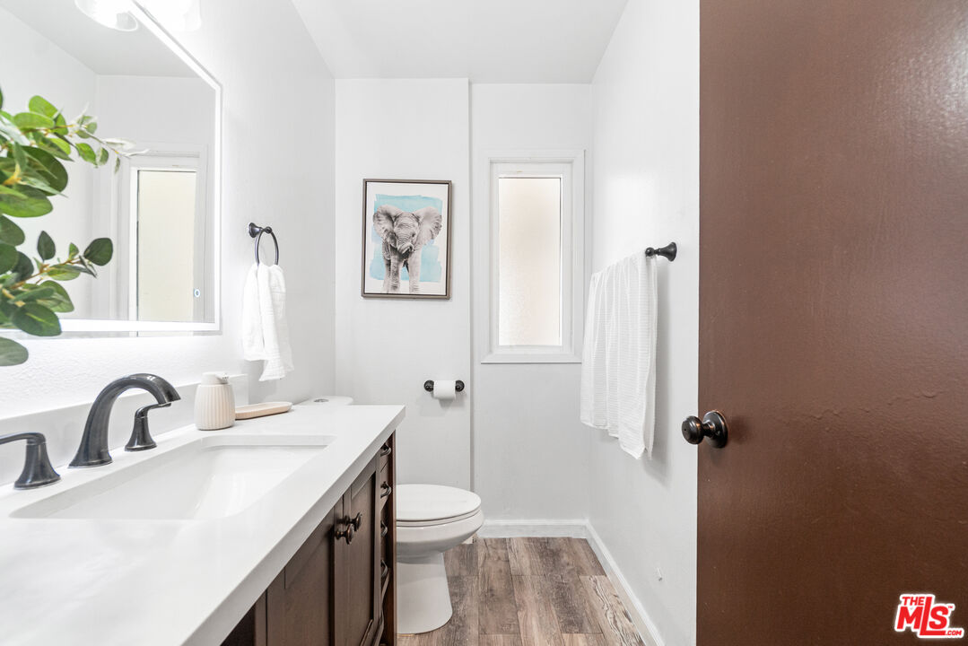 24613 Neptune Avenue Carson, CA 90745 - Photo 16 of 33 a bathroom with a sink toilet and shower