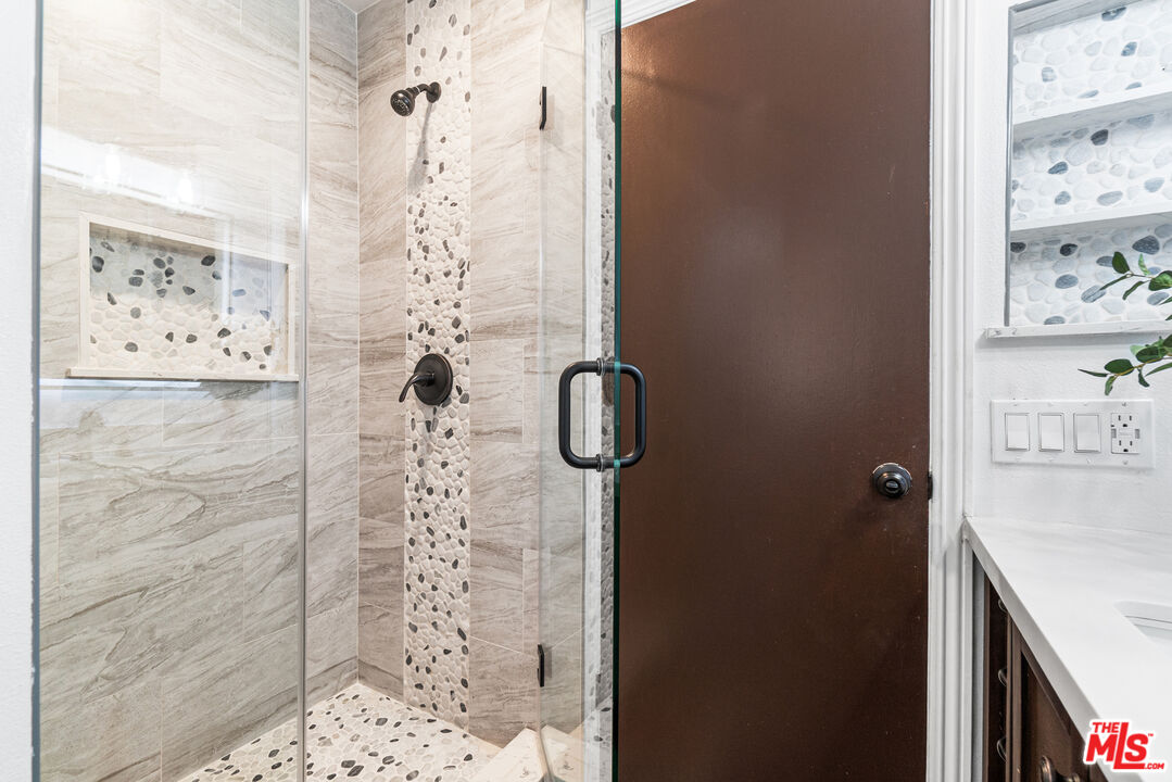 24613 Neptune Avenue Carson, CA 90745 - Photo 17 of 33 a bathroom with a shower