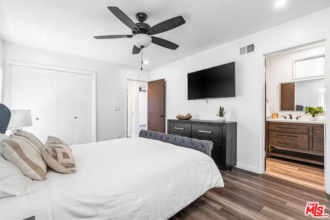 24613 Neptune Avenue Carson, CA 90745 - Photo 19 of 33 a bedroom with a bed and a flat screen tv