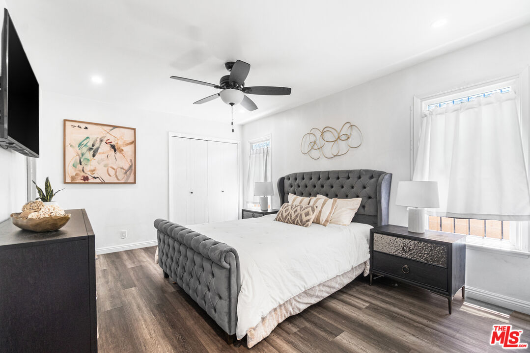 24613 Neptune Avenue Carson, CA 90745 - Photo 20 of 33 a bedroom with a bed and wooden floor