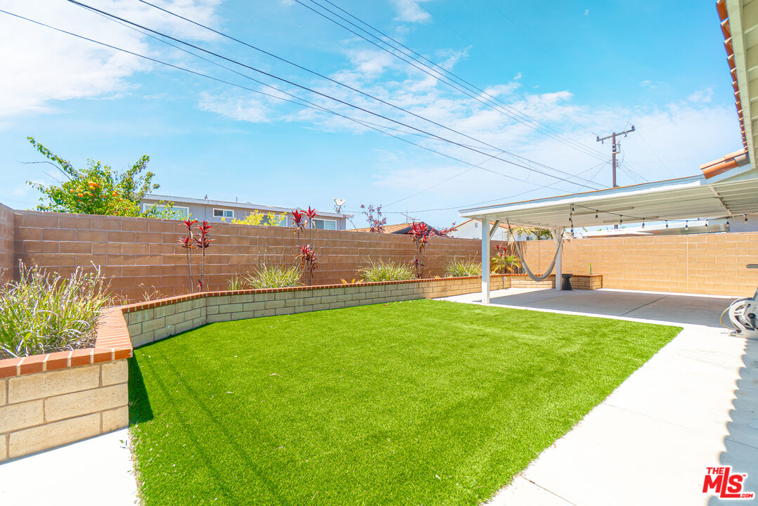 24613 Neptune Avenue Carson, CA 90745 - Photo 28 of 33 a view of a terrace with a garden