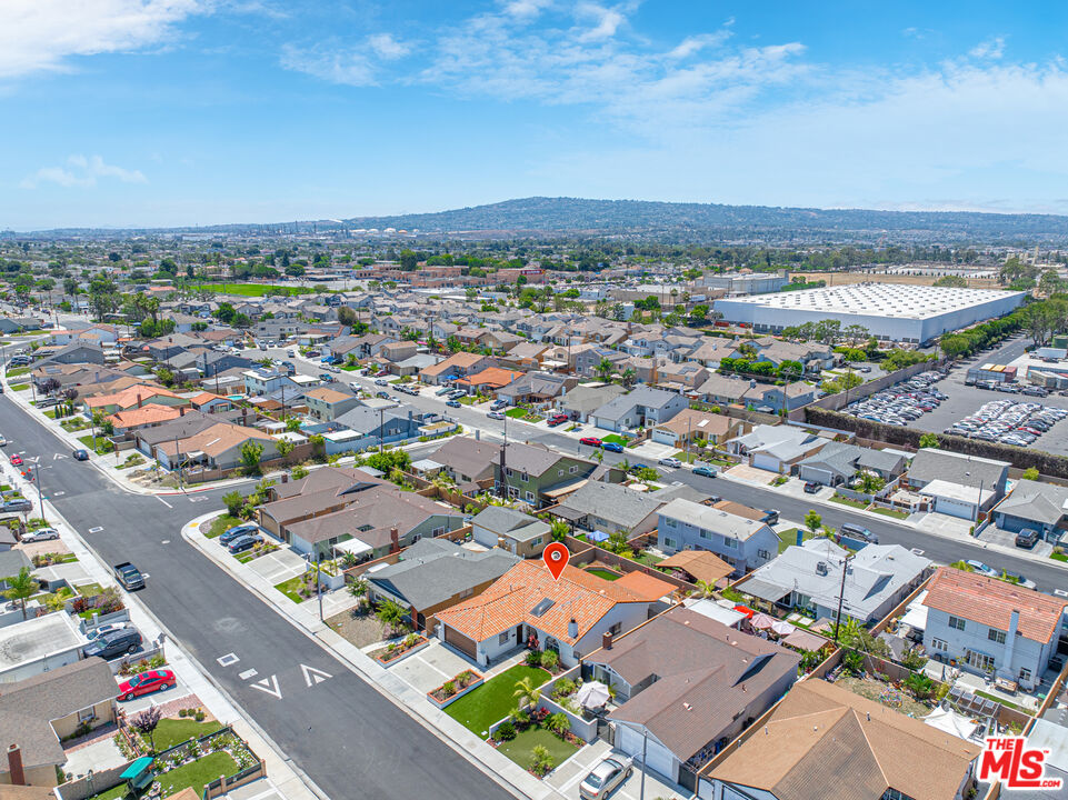 24613 Neptune Avenue Carson, CA 90745 - Photo 32 of 33 an aerial view of a city with lots of residential buildings and mountain view in back