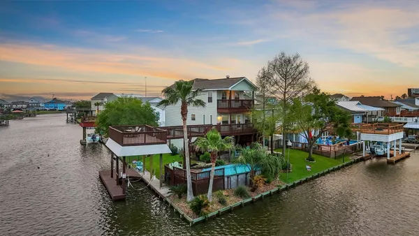 a view of a lake with a house in the background