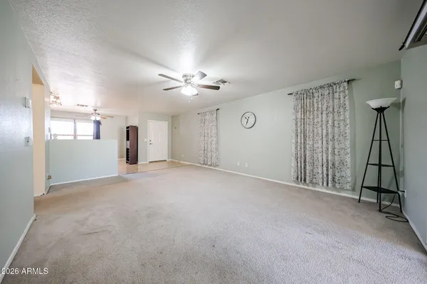 a view of empty room with windows