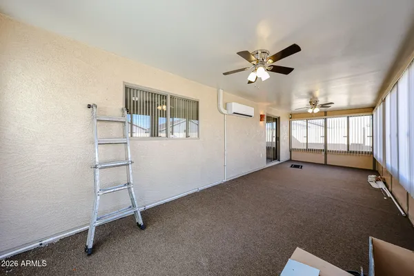 a bed room with a bed and a television