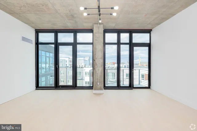 a view of an empty room with a large window