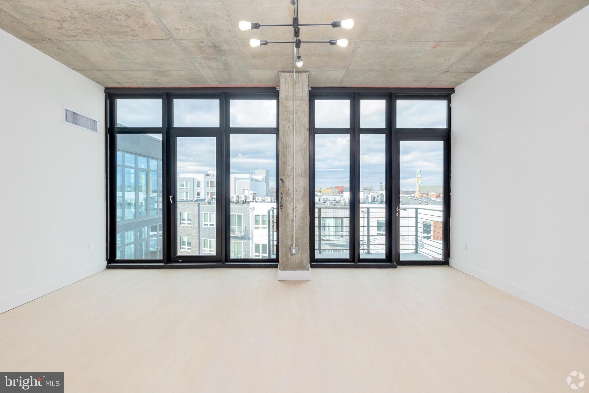 1222 North 2nd Street, Unit 403 Philadelphia, PA 19122 - Photo 15 of 37 a view of an empty room with a large window