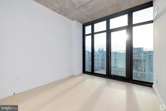 wooden floor in an empty room with glass door