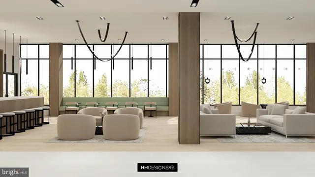 a living room with furniture and large windows