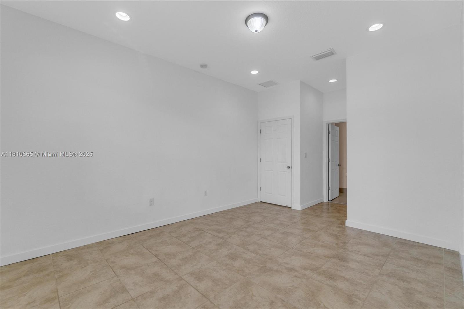 11014 Southwest 237th Lane Homestead, FL 33032 - Photo 19 of 47 a view of an empty room