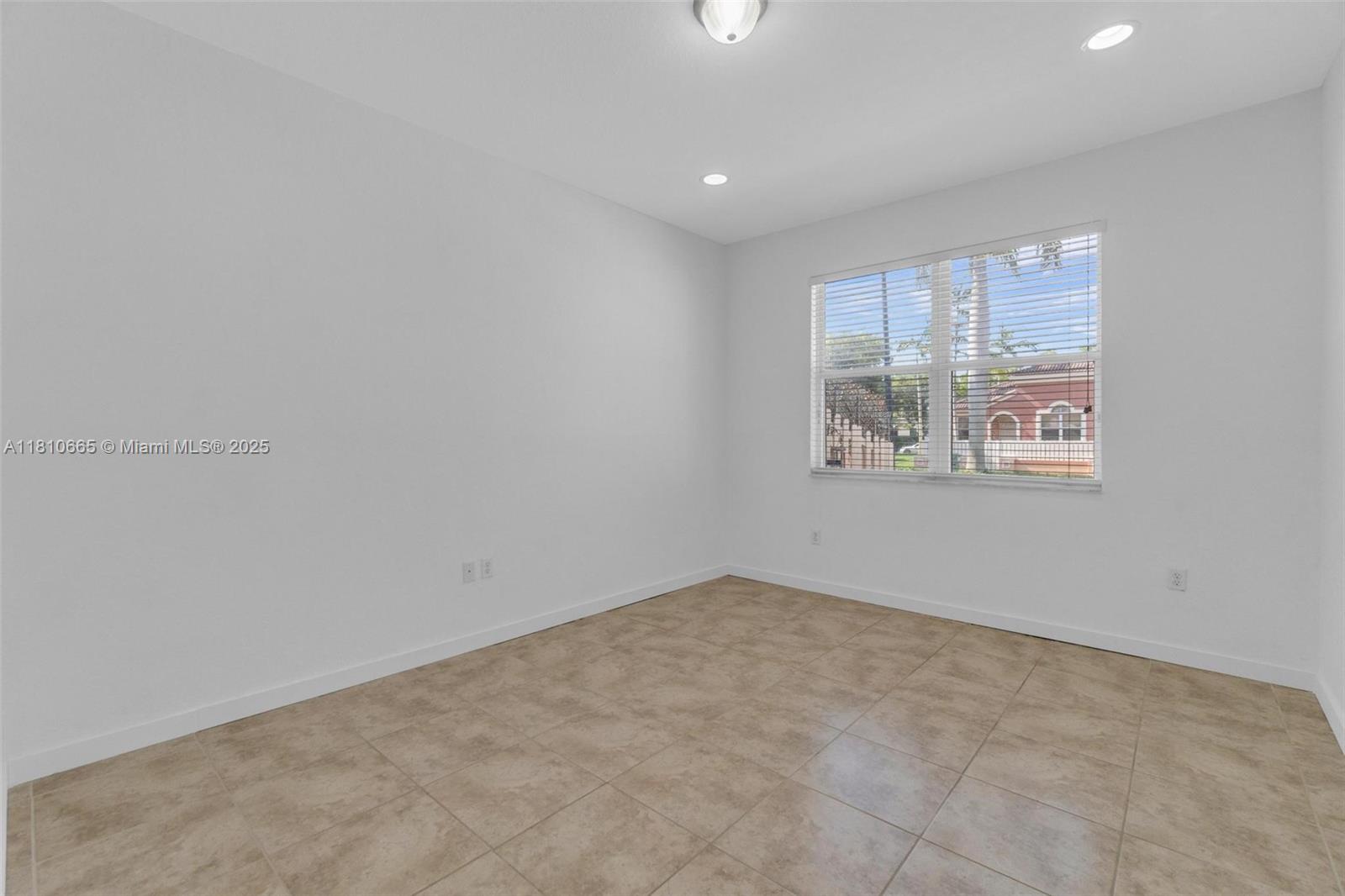 11014 Southwest 237th Lane Homestead, FL 33032 - Photo 30 of 47 an empty room with windows