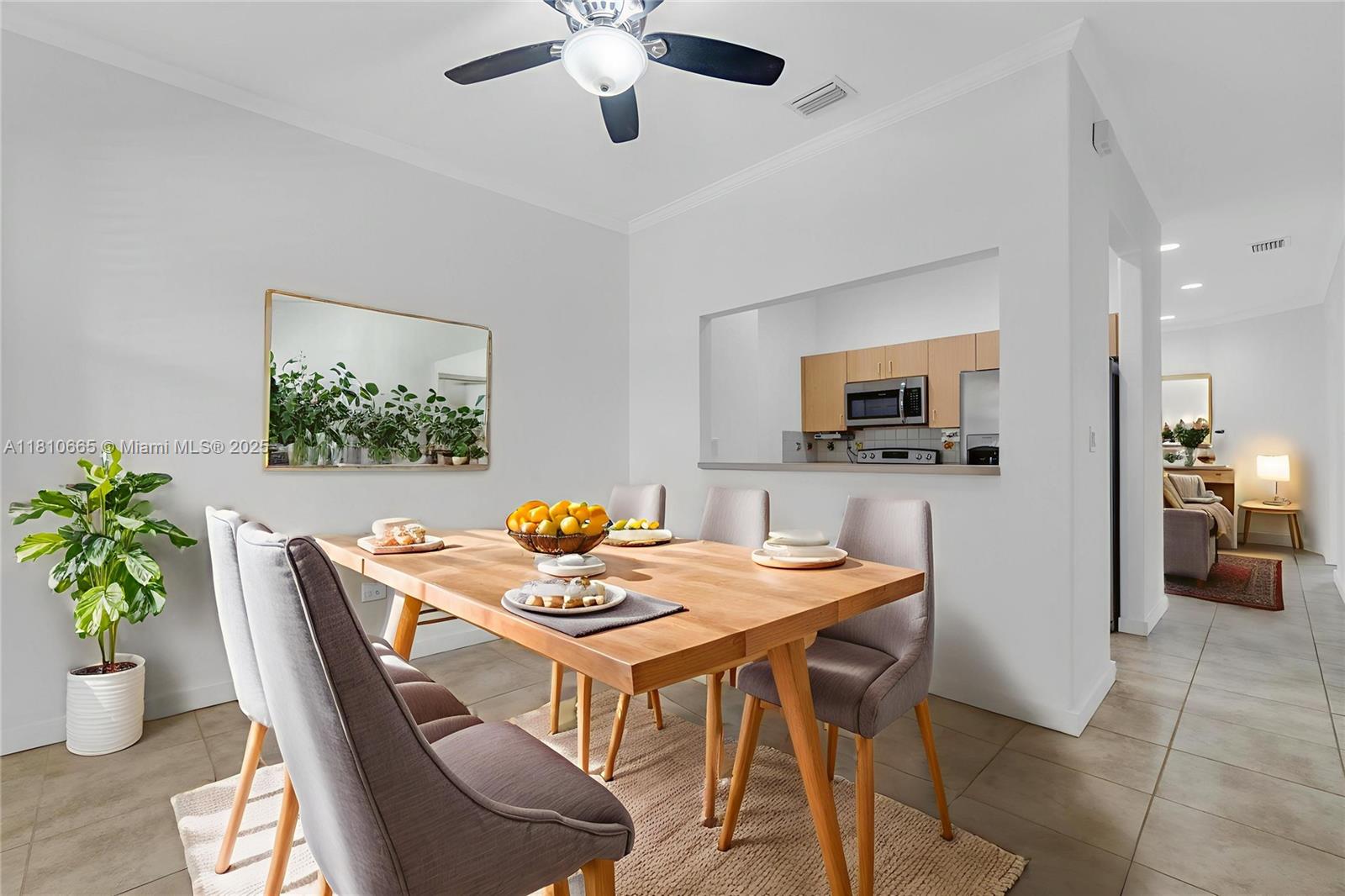 11014 Southwest 237th Lane Homestead, FL 33032 - Photo 3 of 47 a view of a dining room with furniture and a kitchen