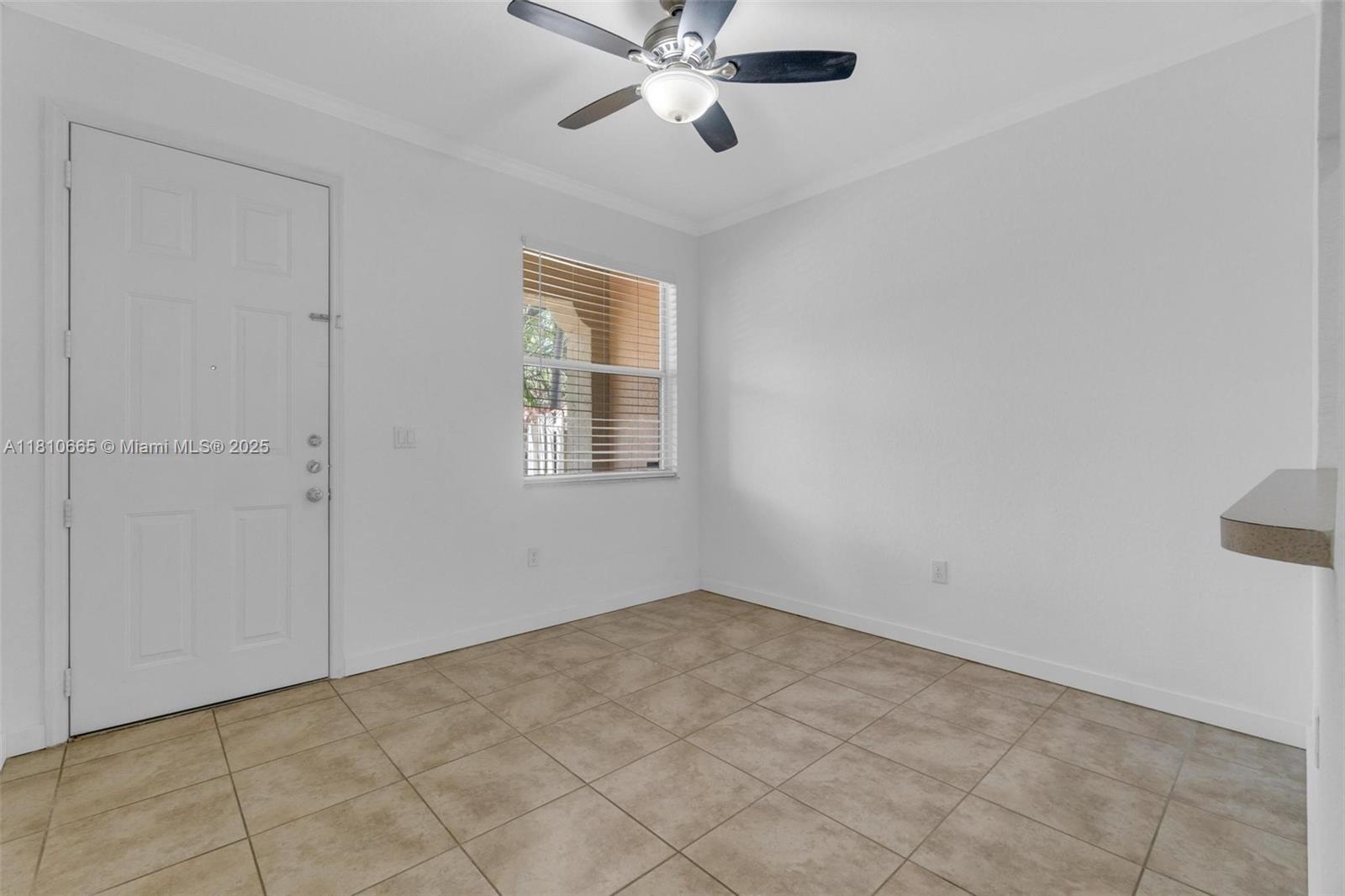 11014 Southwest 237th Lane Homestead, FL 33032 - Photo 34 of 47 a view of an empty room with a window