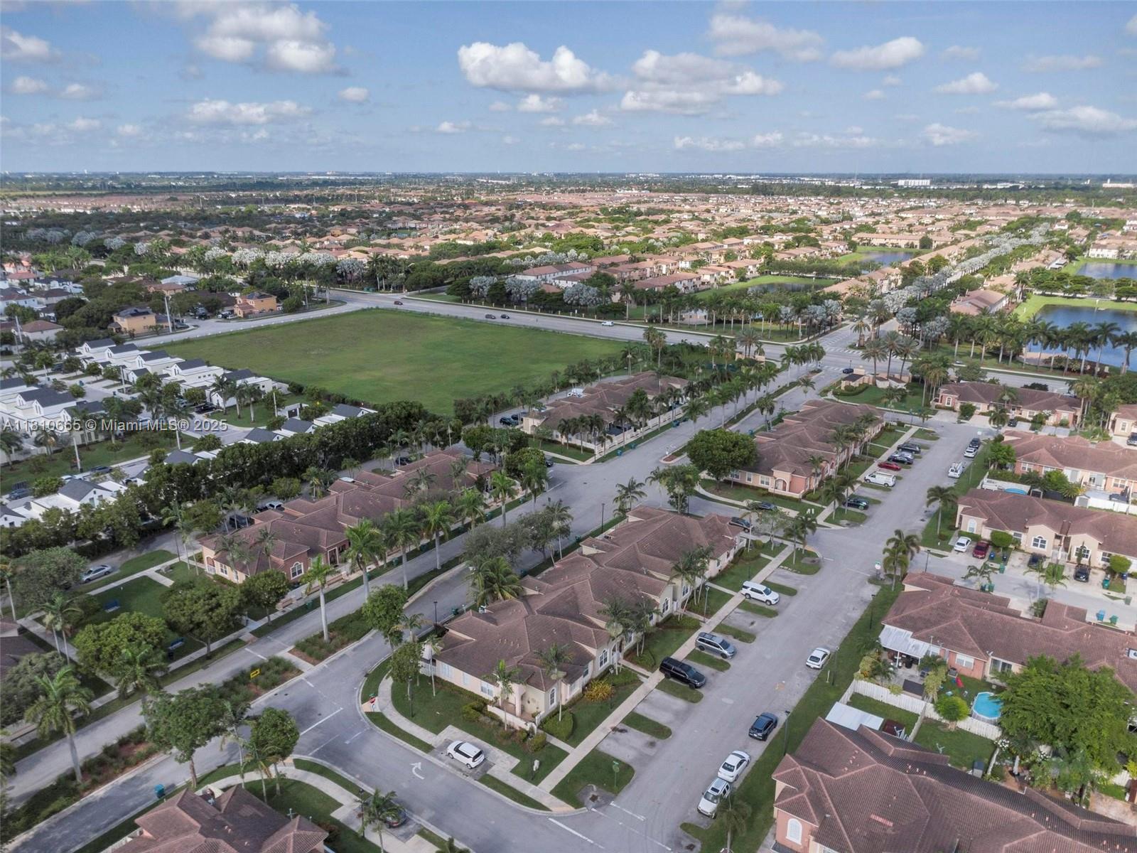 11014 Southwest 237th Lane Homestead, FL 33032 - Photo 41 of 47 an aerial view of residential houses with outdoor space
