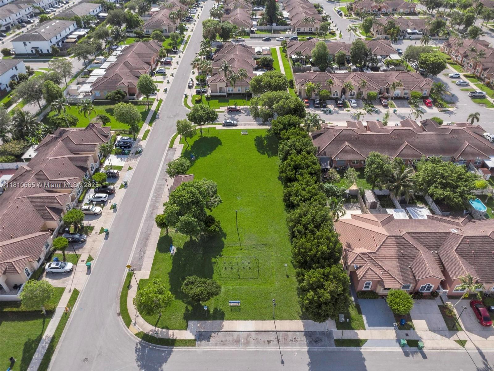 11014 Southwest 237th Lane Homestead, FL 33032 - Photo 46 of 47 an aerial view of residential houses with outdoor space