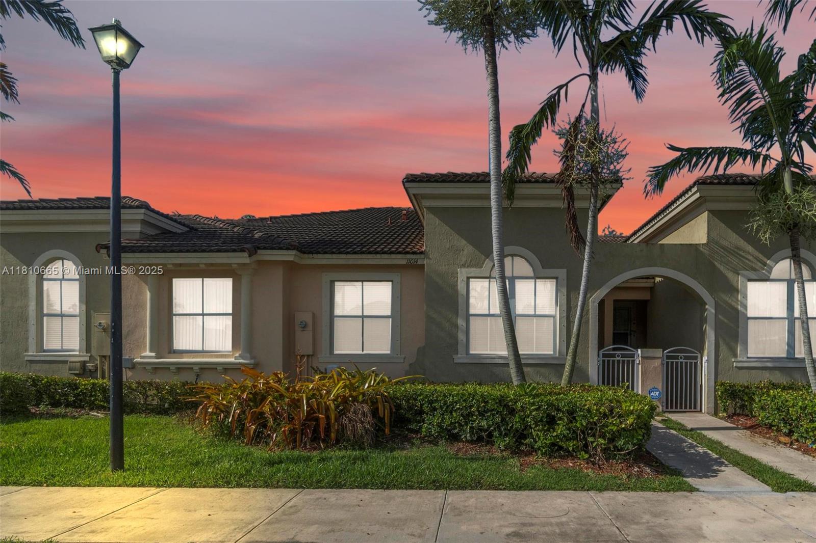 11014 Southwest 237th Lane Homestead, FL 33032 - Photo 47 of 47 a front view of a house with a garden