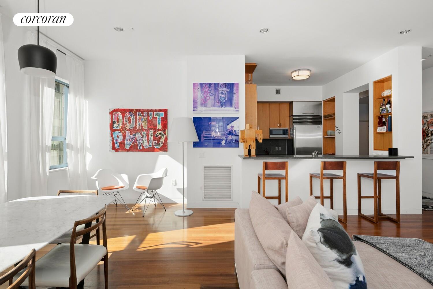 52 Thomas Street, Unit 3D Manhattan, NY 10013 - Photo 5 of 13 a living room with furniture and a flat screen tv