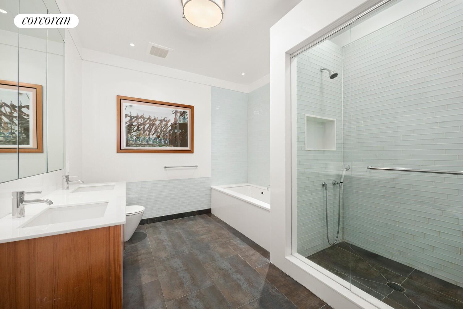 52 Thomas Street, Unit 3D Manhattan, NY 10013 - Photo 7 of 13 a bathroom with a tub sink shower and a mirror