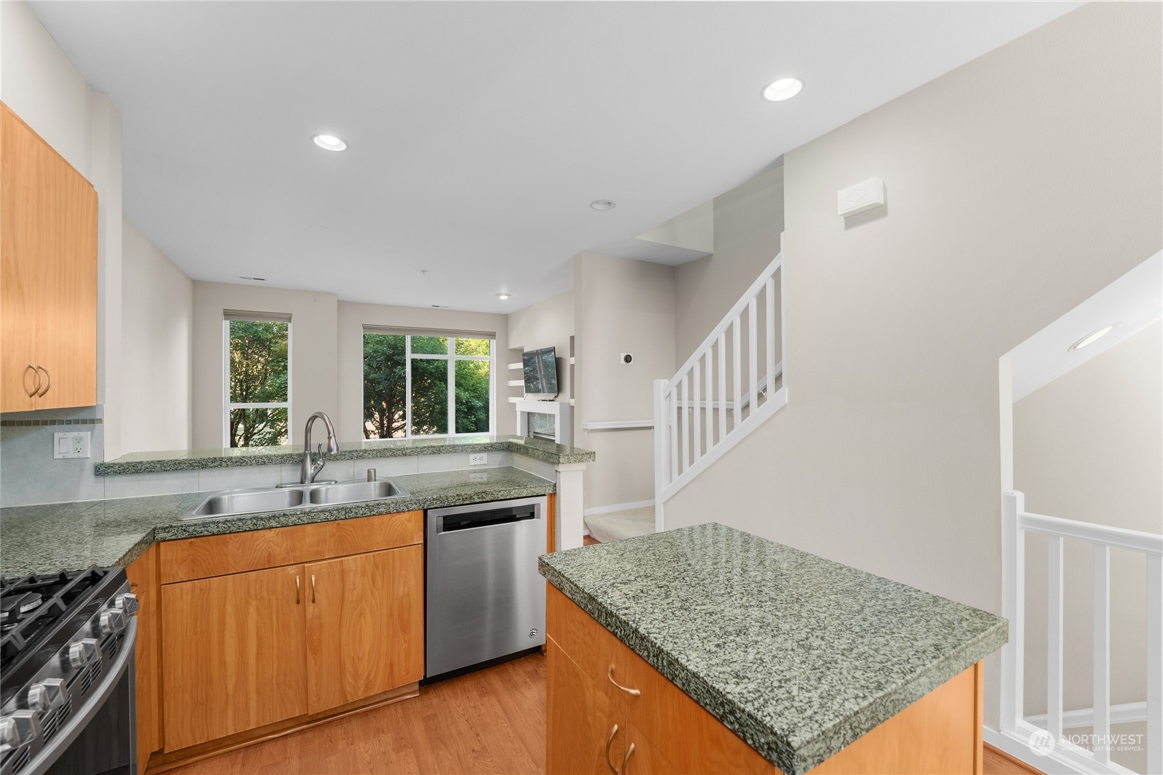 139 Cougar Ridge Road Northwest Issaquah, WA 98027 - Photo 9 of 25 a kitchen with sink cabinets and stove
