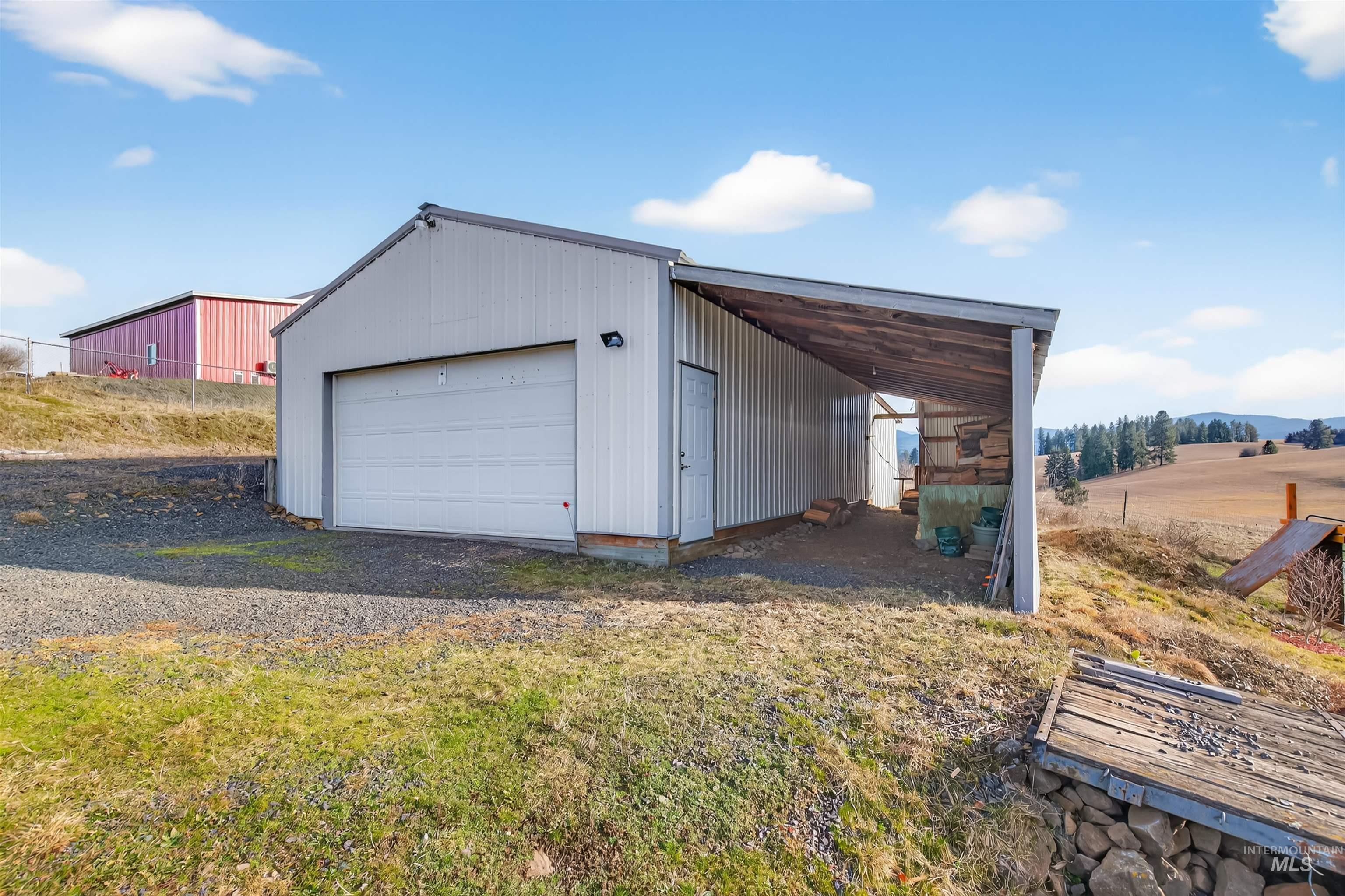 108 Tweedy Lane Kooskia, ID 83539 - Photo 2 of 48 Garage featuring a detached garage and driveway
