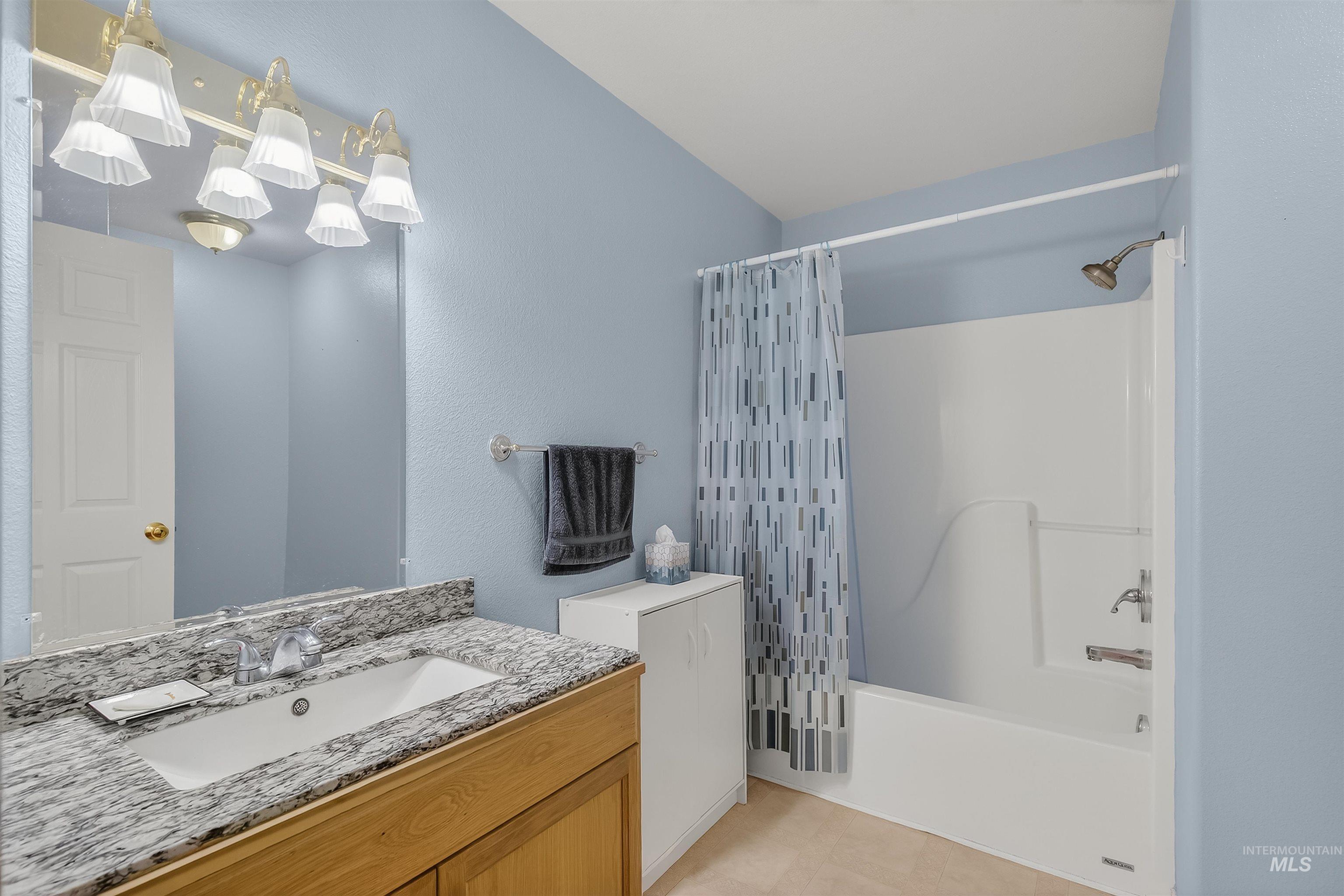 108 Tweedy Lane Kooskia, ID 83539 - Photo 35 of 48 Bathroom featuring vanity and shower / bath combo with shower curtain