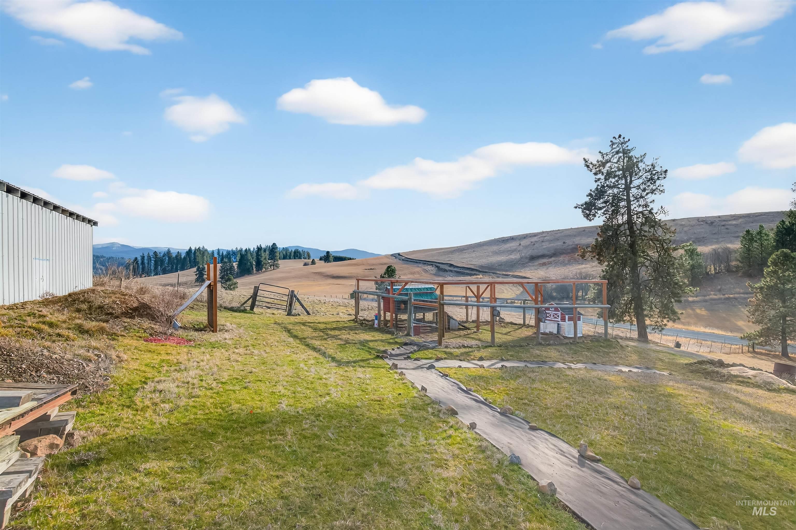 108 Tweedy Lane Kooskia, ID 83539 - Photo 10 of 48 View of yard featuring a rural view, a mountain view, and a playground