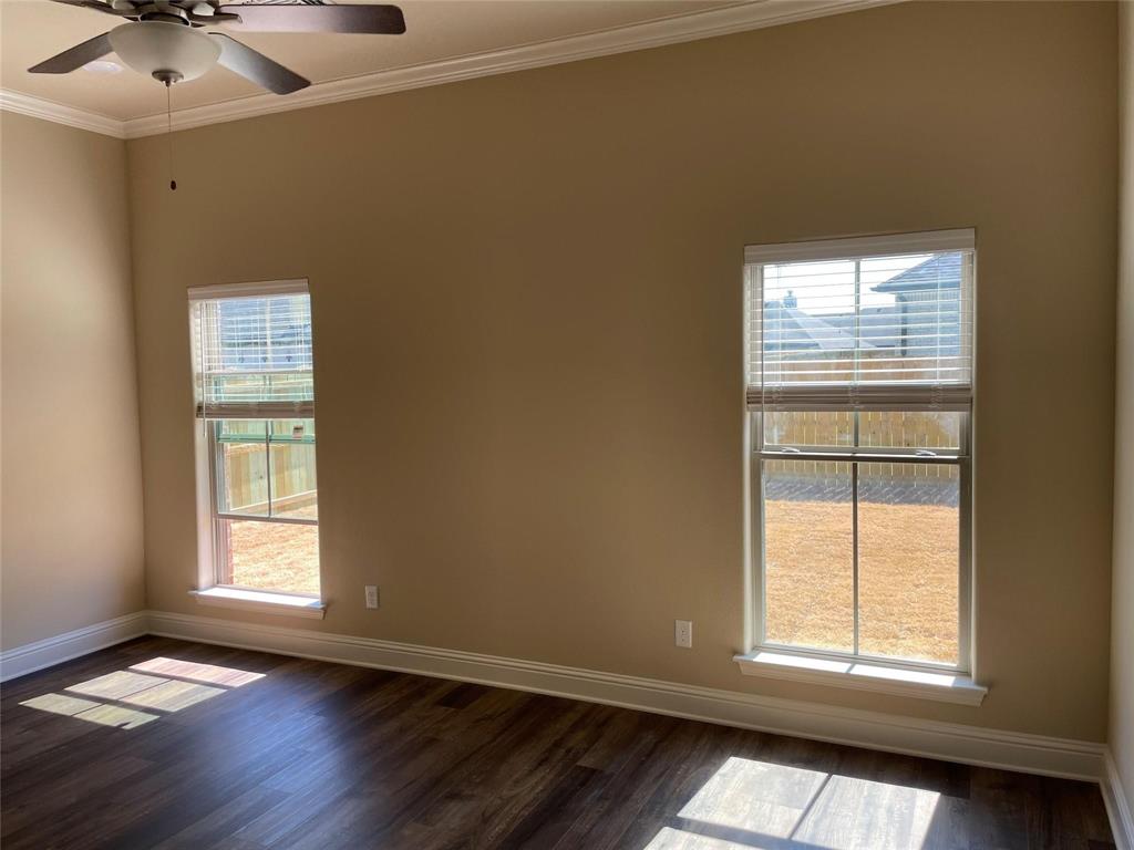 634 Nolan Drive Sherman, TX 75092 - Photo 11 of 18 an empty room with wooden floor and windows