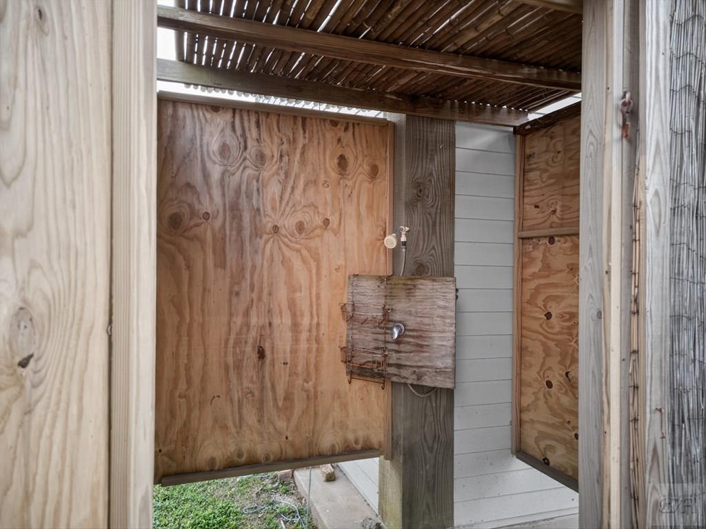 1739 Pompano Lane Crystal Beach, TX 77650 - Photo 19 of 20 a bathroom with a shower and a sink